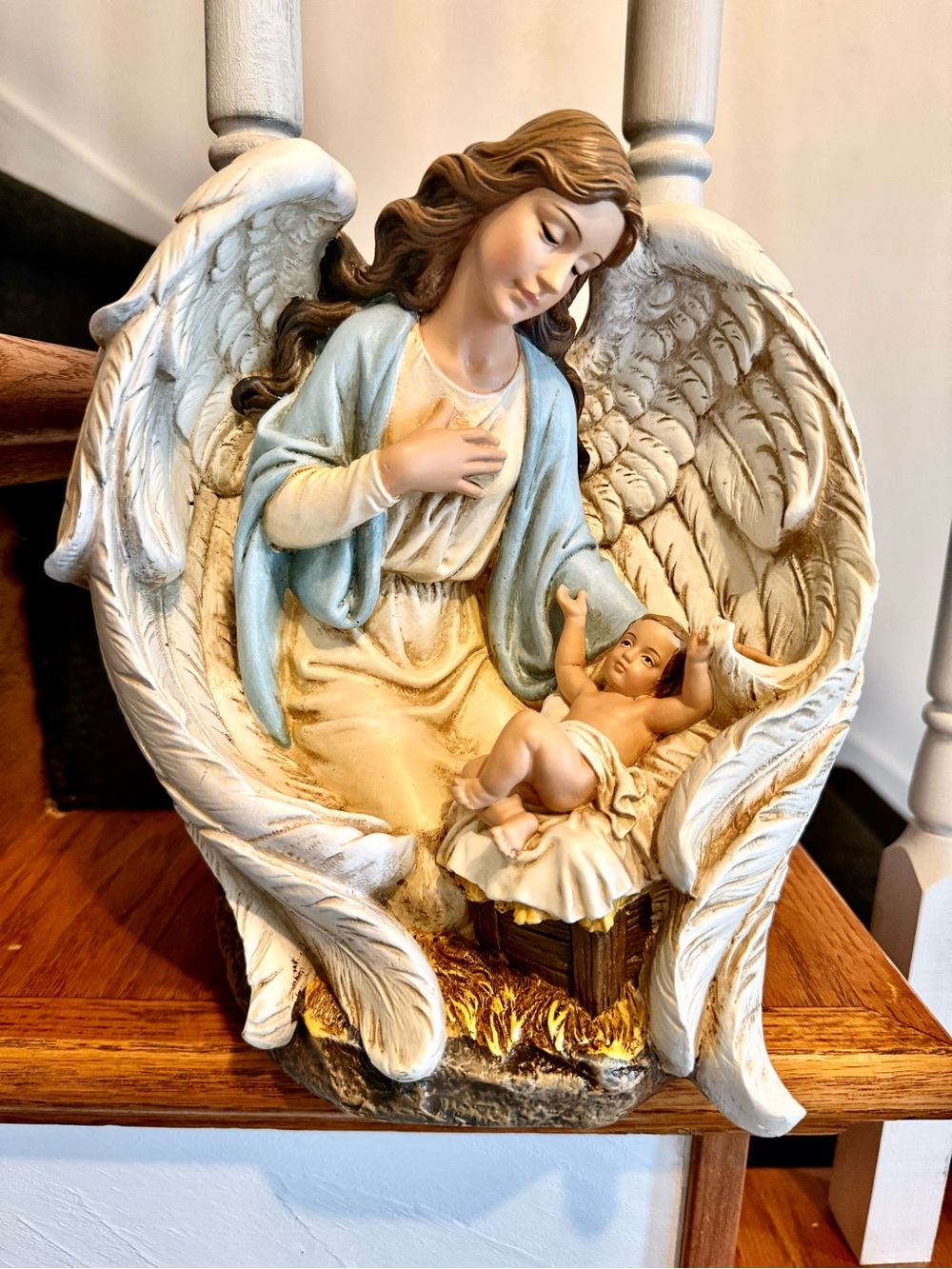 Serene Angel Sculpture with Baby Jesus. Bought out boutique.